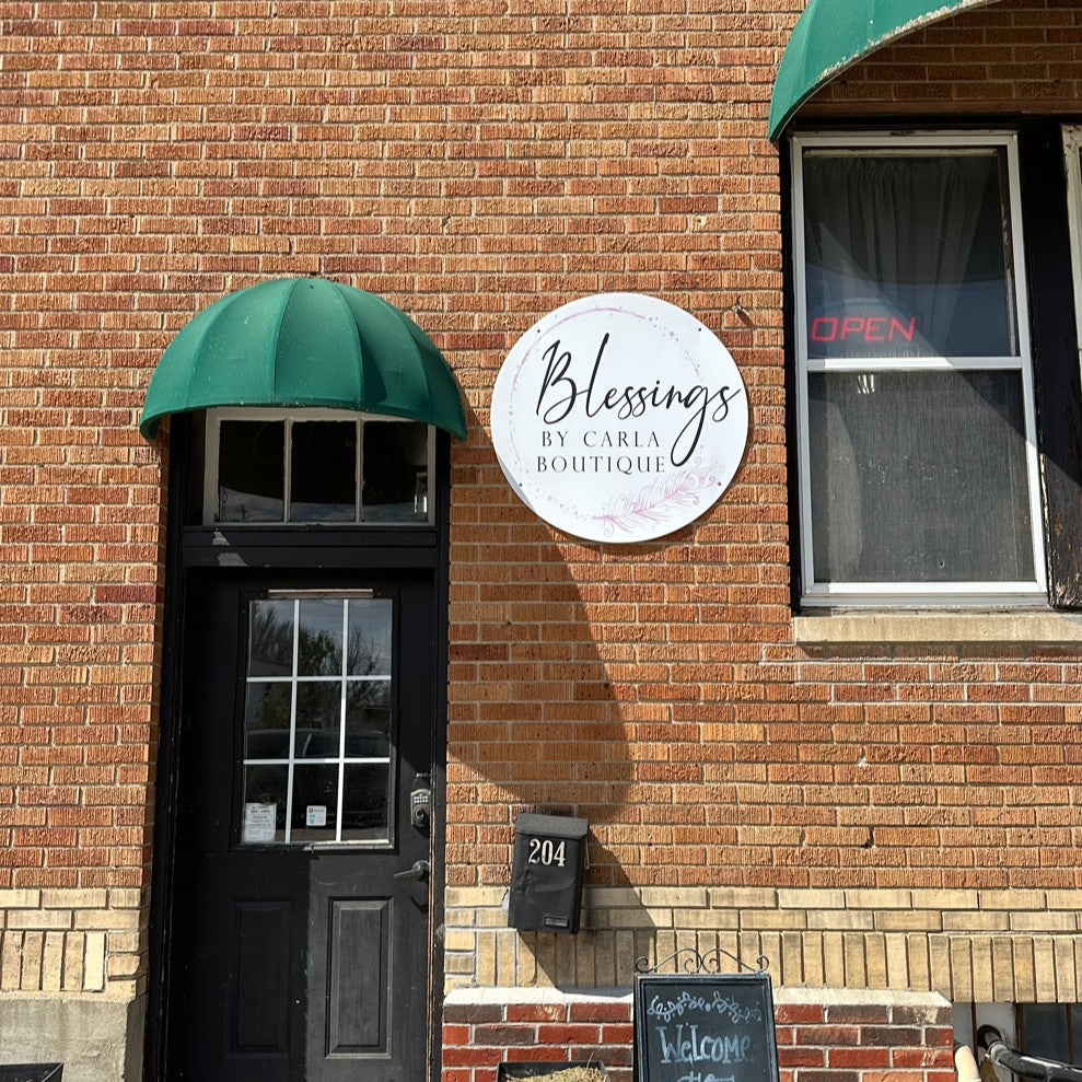 Custom exterior building sign for Blessings by Carla Boutique in Jamestown, ND.