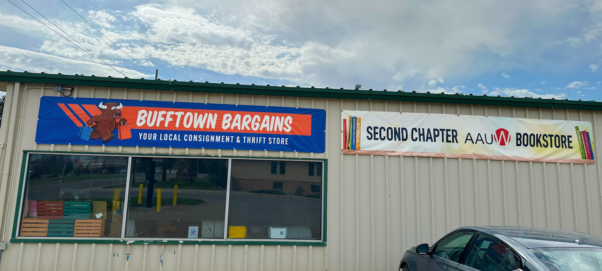 Custom outdoor banners for Bufftown Bargains and Second Chapter Bookstore storefront in Jamestown, ND.