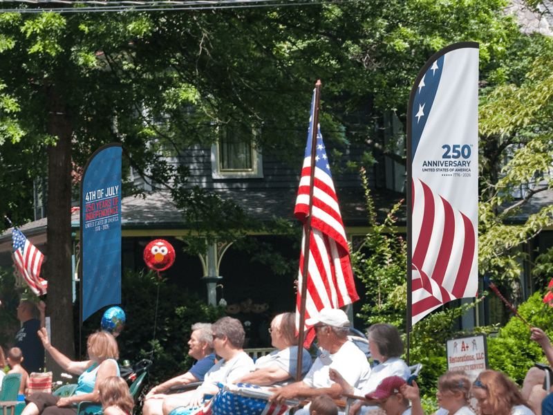 Custom flag banners for outdoor parades and events celebrating America's 250th Anniversary in Bismarck, ND.