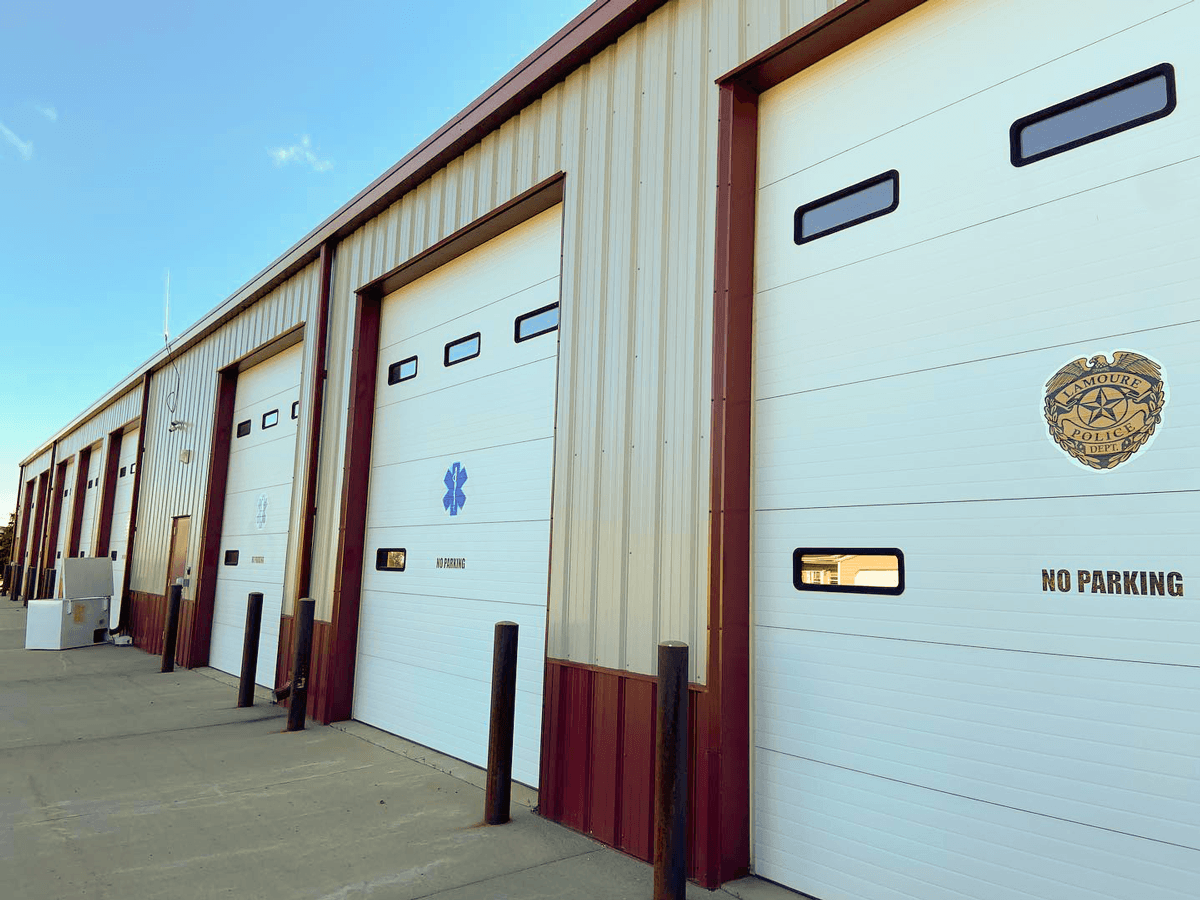Custom logo emblem die-cut stickers and decals for outdoor garage signage in Jamestown, ND.