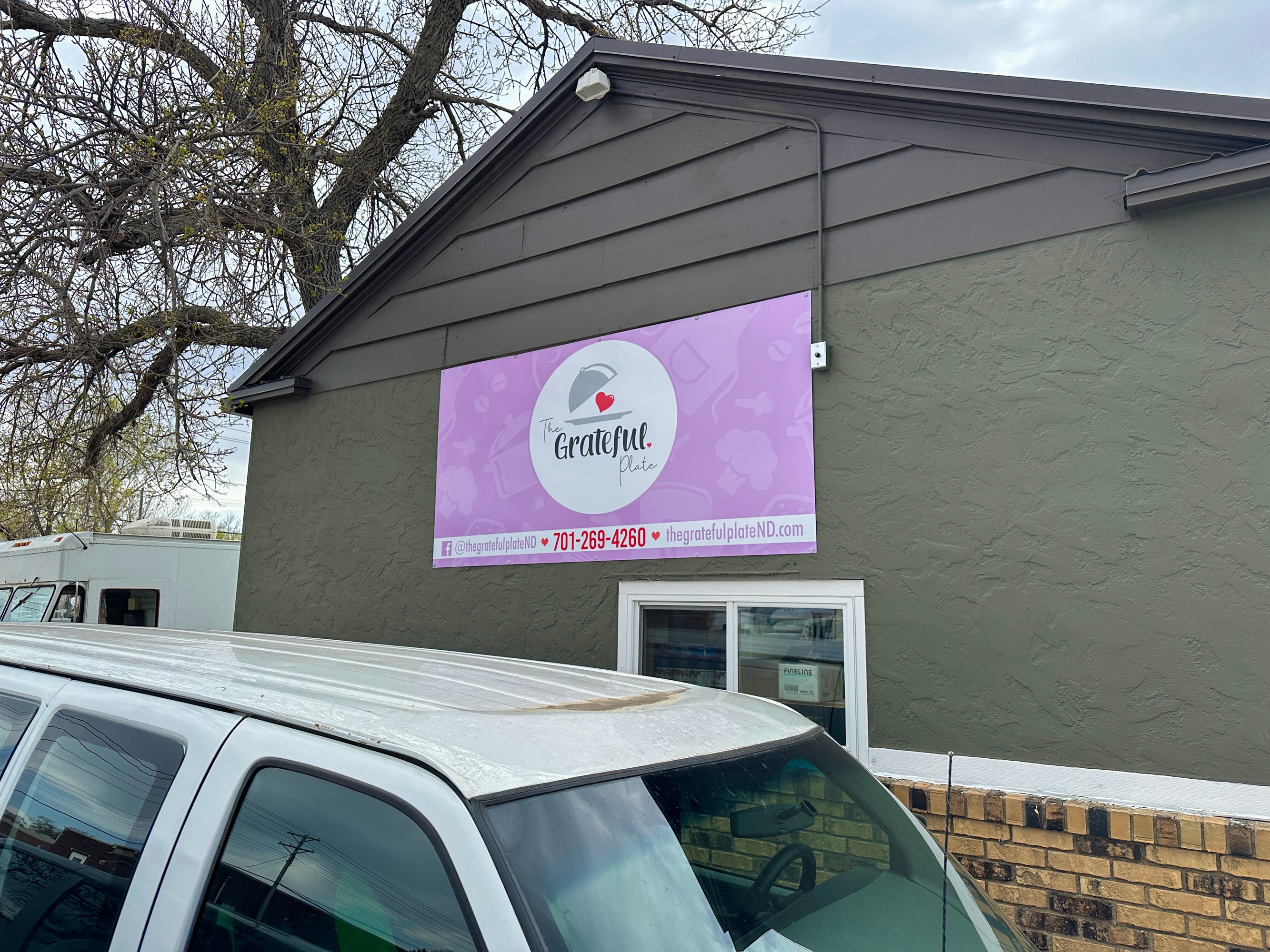 Custom exterior building sign for The Grateful Plate Business in Jamestown, ND.