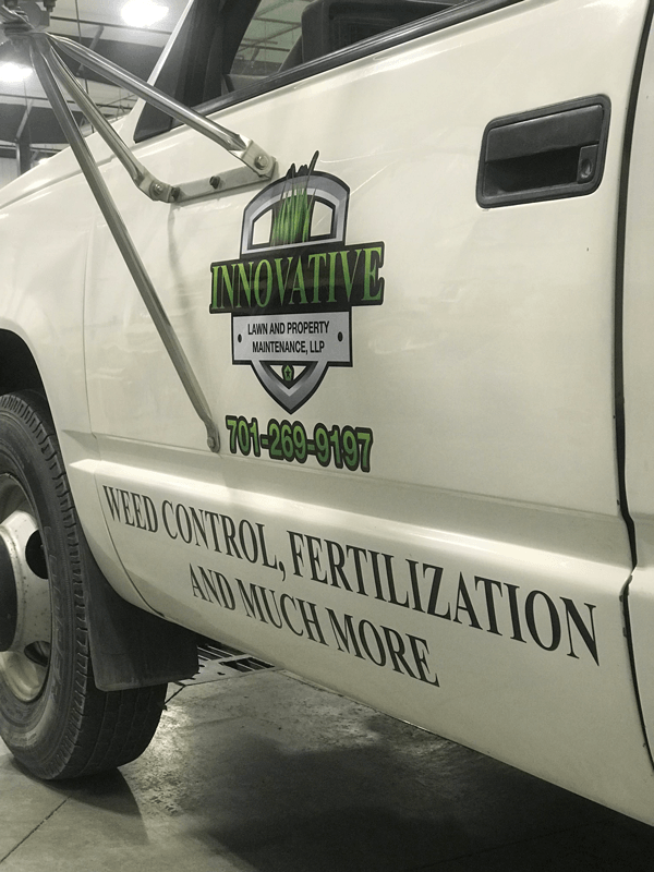 Custom company logo decals and property maintenance vehicle graphics in Jamestown ND