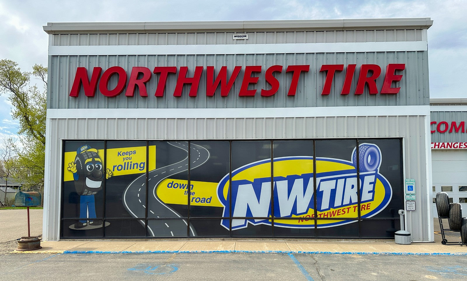 Custom full color perforated window graphics for Northwest Tire in Jamestown, ND.