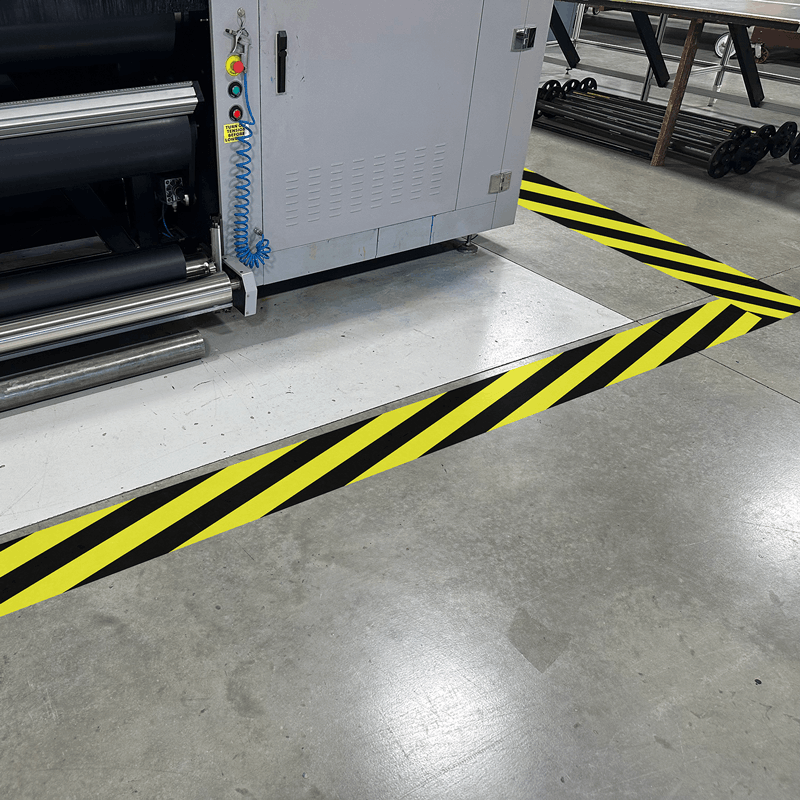 Custom vinyl floor decals for facility safety signage in Jamestown, ND.