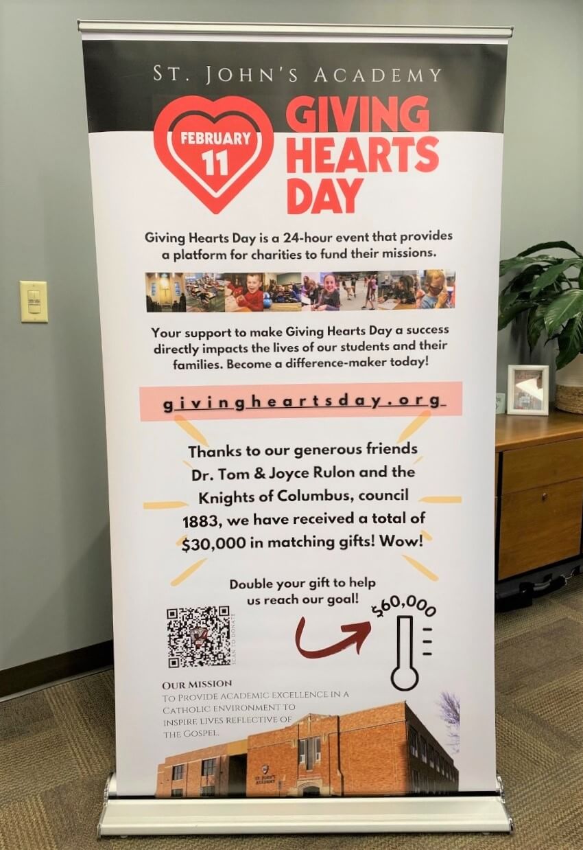 Custom retractable roll up banner for St. John's Academy Giving Hearts Day event in Jamestown, ND.