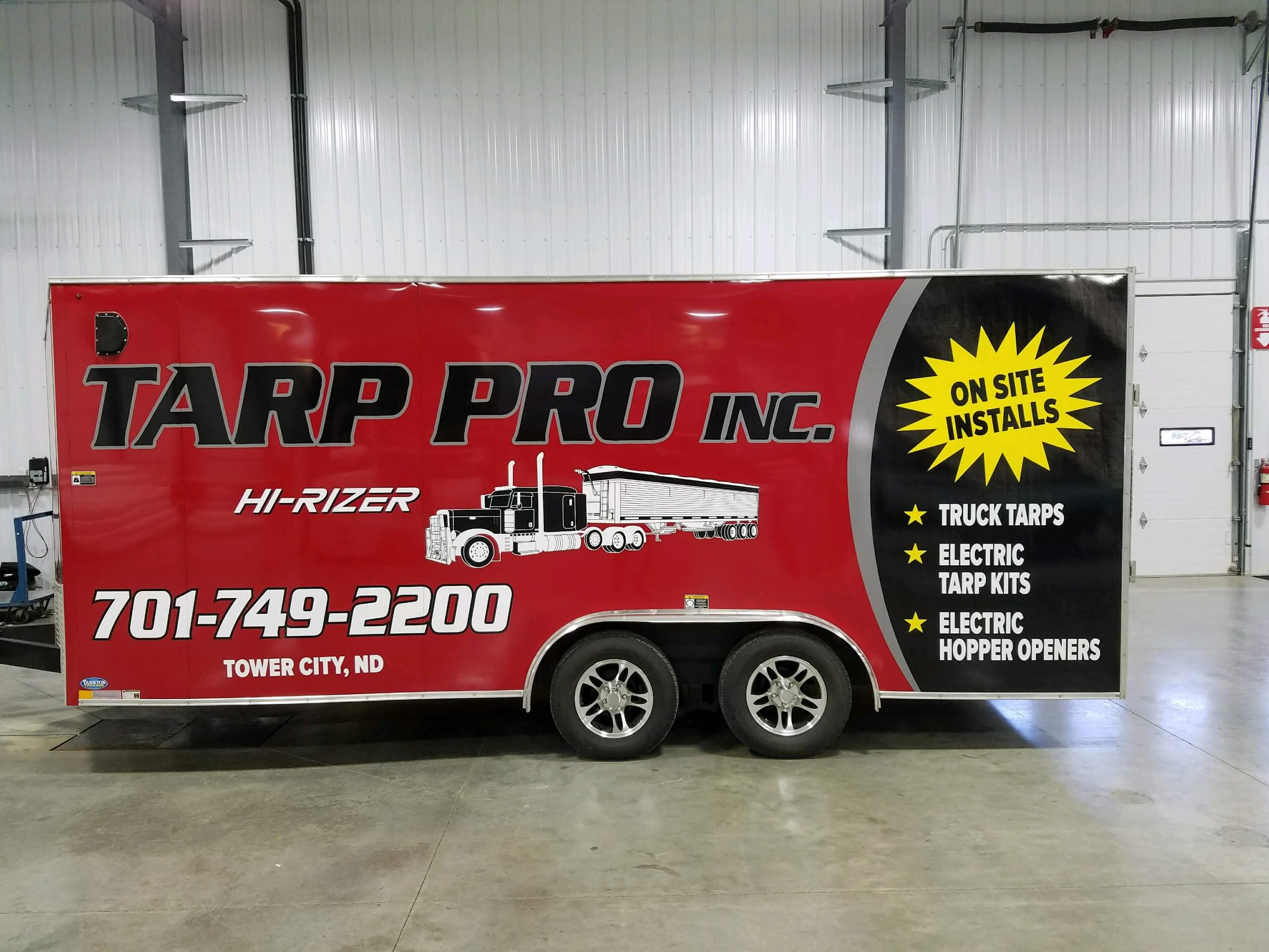 Trailer with custom Tarp Pro branding wrap in Tower City, ND.