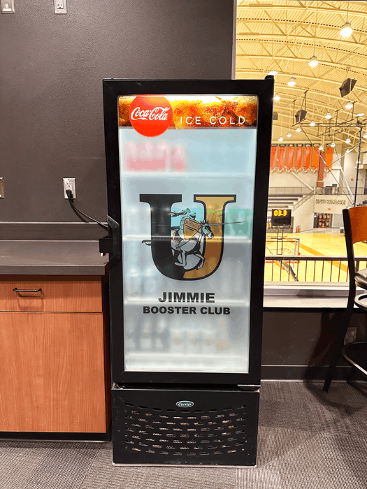 Custom die-cut decals for glass window on a fridge in a university booster room in Jamestown, ND.