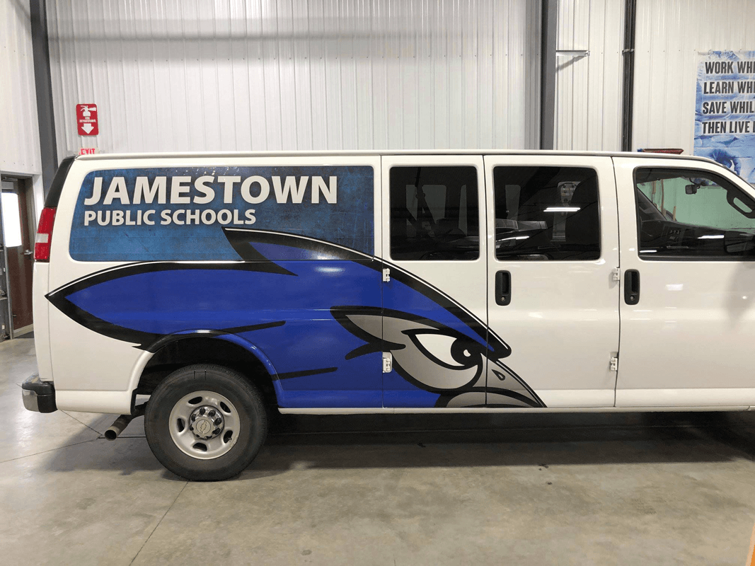 Van with Jamestown Public Schools logo in Jamestown, ND.