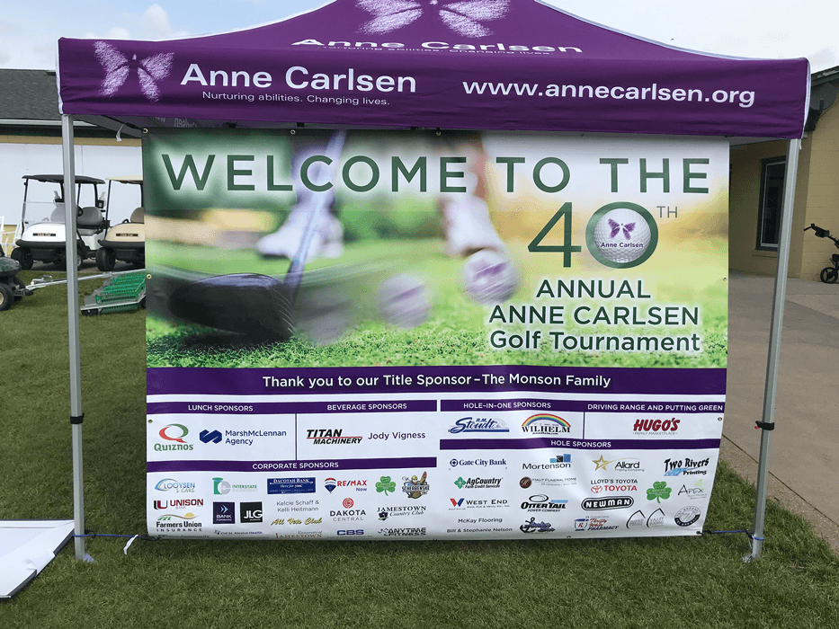 Custom vinyl outdoor sponsor banner for Anne Carlsen Golf Tournament in Jamestown, ND. 