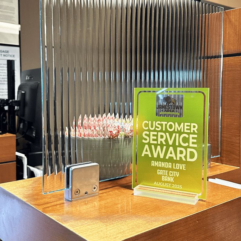 Customer service award on a desk with a blurred background in Gate City Bank Jamestown, ND.