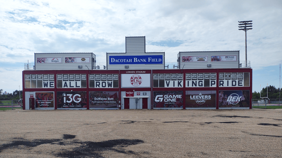 Custom vinyl banners for outdoor sports signage at football field in Valley City, ND.