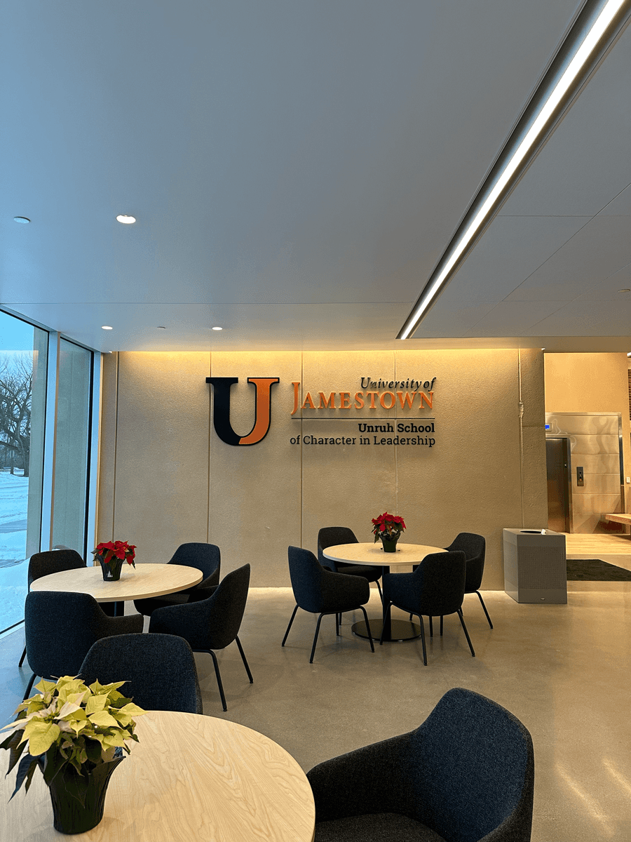 University of Jamestown logo on wall in student lounge in Jamestown, ND.