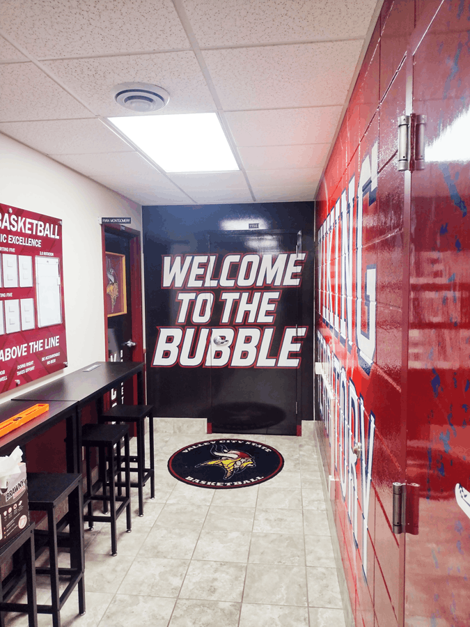 Custom locker room wall graphics and decals for university branding in Valley City, ND.