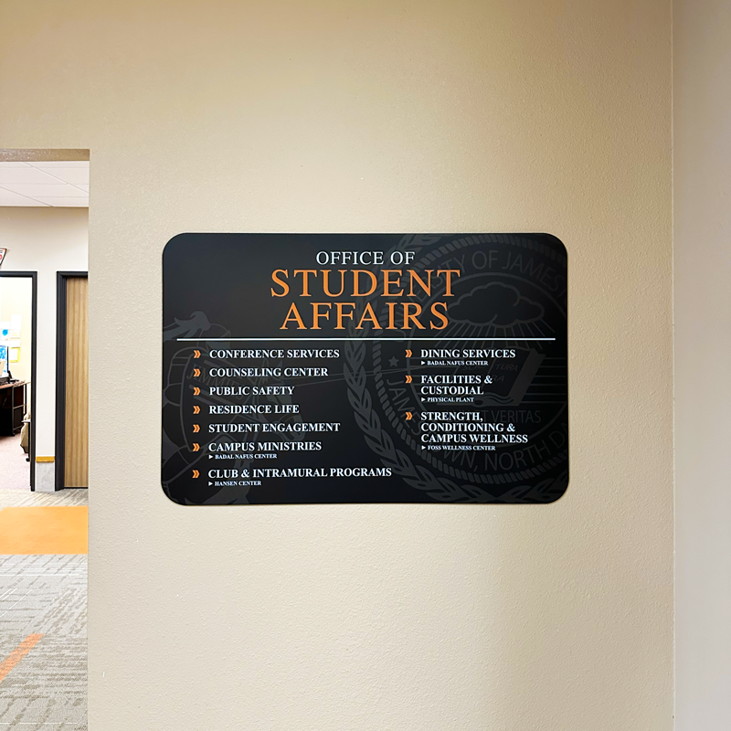 Custom wayfinding sign on campus for Office of Student Affairs in Jamestown, ND.